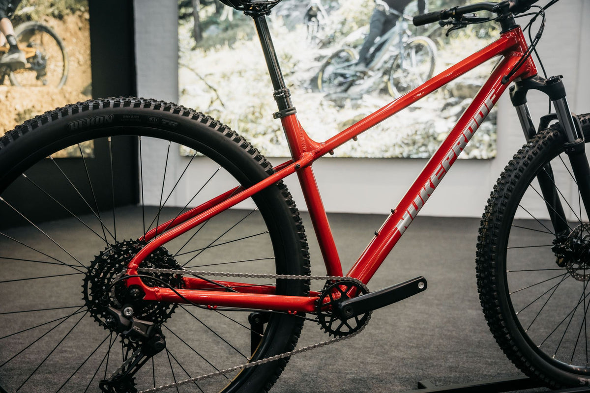 Ratas Nukeproof Tracker Comp CUES 1x10 (XS), racing punane
